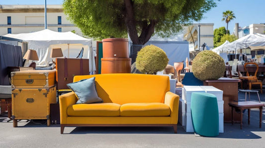 out of place modern yellow couch being sold at a flea market