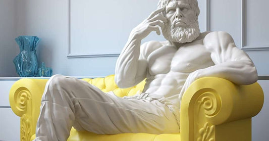 The Thinker on a bright yellow sleeper sofa contemplating