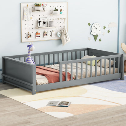 A gray Floor Platform Bed with Built-In Book Storage Rack and a thin mattress is in a light blue room. A stuffed toy rests on it, with a wooden floor showcasing a geometric rug. A wall organizer and clock are visible in the background.