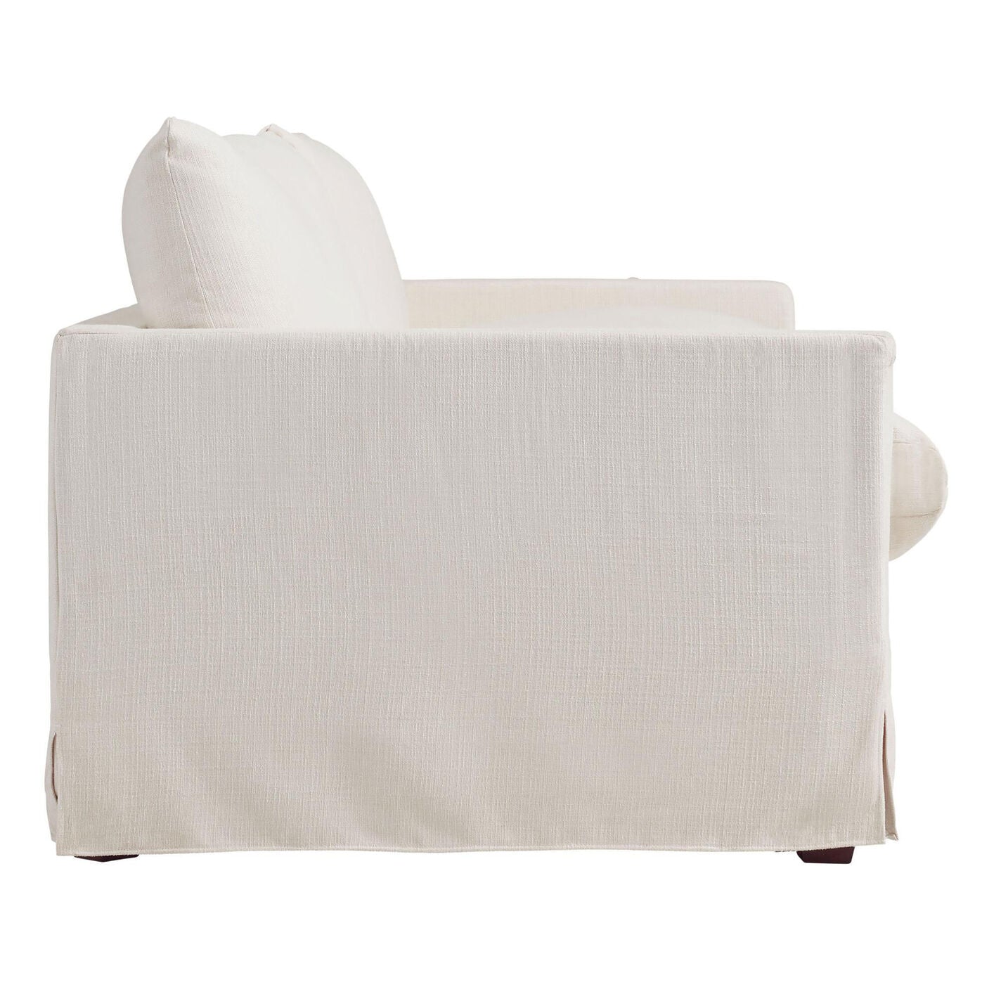 Side view of the Brynn Feather-Filled Sofa, showcasing its clean, minimalist design in white fabric. The sofa boasts a smooth slipcover and rectangular cushions, accompanied by low, straight armrests. It is supported by dark wooden legs.