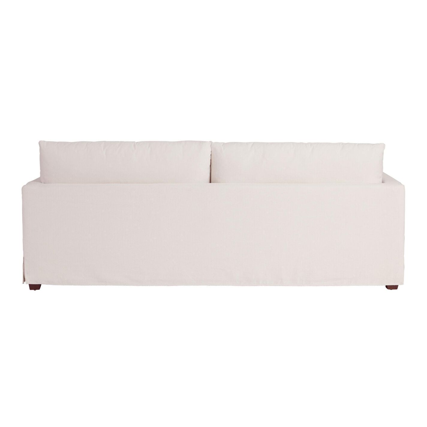 The Brynn Feather-Filled Sofa features a cream-colored, minimalist design when viewed from the back. It has two large back cushions and lacks visible armrests, with its wooden legs subtly showing underneath. The fabric boasts a smooth texture.