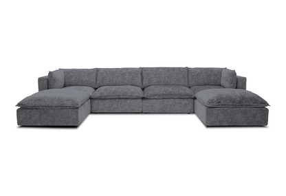 The Haine Modular Grand U-Sofa Sectional is a spacious, contemporary gray sofa featuring plush cushions arranged in a U-shape, set against a white background.