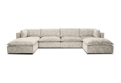 The Haine Modular Grand U-Sofa Sectional is a spacious, light gray sectional with plush cushions set against a white background. It boasts a modern design featuring chaises on both the left and right sides.