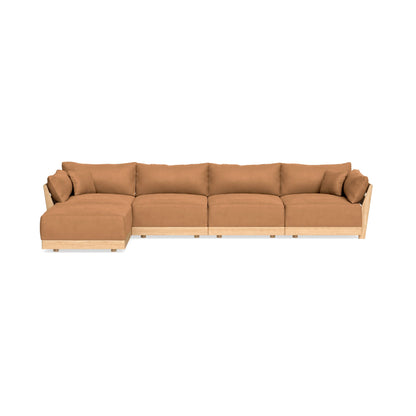 The Modular Bondi Latte 4 Seater Sectional is a spacious L-shaped sectional sofa featuring brown cushions and a light wood frame on a white background. It includes four seating sections and wide armrests, offering both comfort and a modern design.