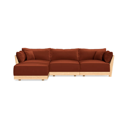 The Modular Bondi Latte 3 Seater Sectional features plush, rust-colored cushions on a light wood frame and includes a left-sided chaise, elegantly set against a plain white background.