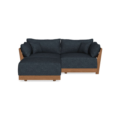 A modern sectional sofa with dark blue cushions and wooden frame, featuring a left-facing chaise. The design is sleek and contemporary, suitable for a living room setting, with plush back and seat cushions for comfort.