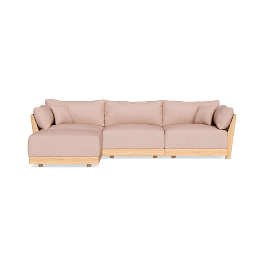 The Modular Bondi Latte 3 Seater Sectional is a beige sofa with a left-facing chaise lounge. It boasts soft cushions and a light wooden frame, showcased against a white background.