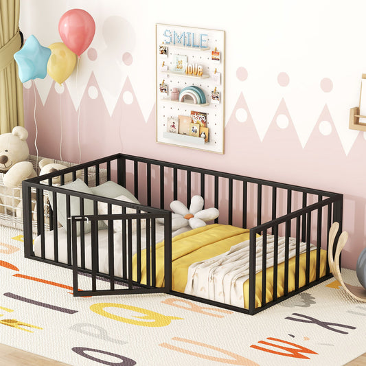 A Metal Floor Bed Frame with Fence and Door in black is set against a pink and white wall. It features colorful bedding and is adorned with balloons, a "SMILE" poster, a plush teddy bear, and a shelf displaying small toys. A vibrant rug decorates the floor.