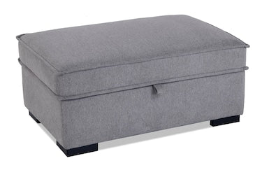 A gray upholstered sectional chaise with a liftable top and black legs.