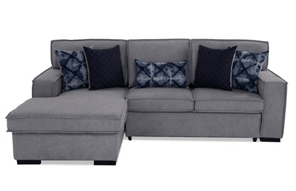 The Playscape Gray 94'' 2 Piece Pop-Up Sleeper Chaise Sectional features a sleek gray design with an attached chaise lounge on the left. It comes adorned with five blue and black patterned cushions, offering a modern and stylish look perfect for any contemporary living room.