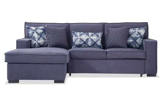 The Playscape Gray 94'' 2 Piece Pop-Up Sleeper Chaise Sectional includes an attached chaise on the left side, accompanied by three geometric-patterned pillows and two solid-colored pillows in varying shades of blue, offering a stylish and comfortable seating arrangement.