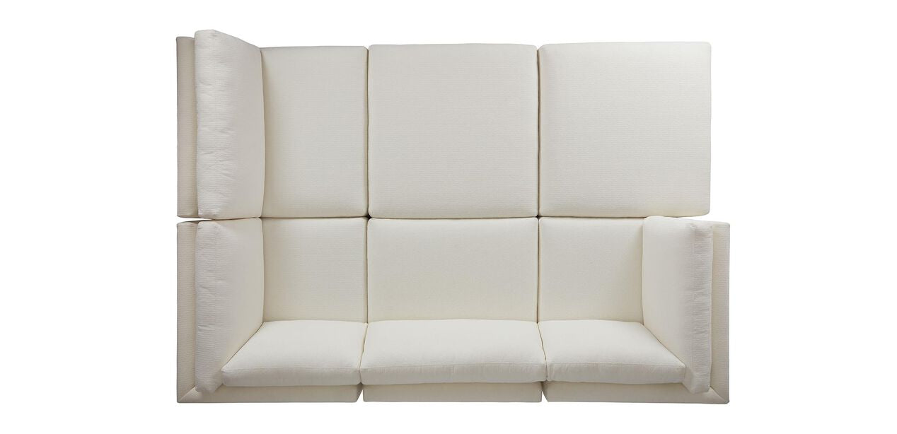 Introducing the Daydreamer Modular Six-Piece Sectional: a contemporary, beige sofa featuring a distinctive block-like design with three seat cushions and a high backrest. Its sectional arms create an inviting and intimate seating area, perfect for relaxation. The sofa is elegantly showcased against a white background.