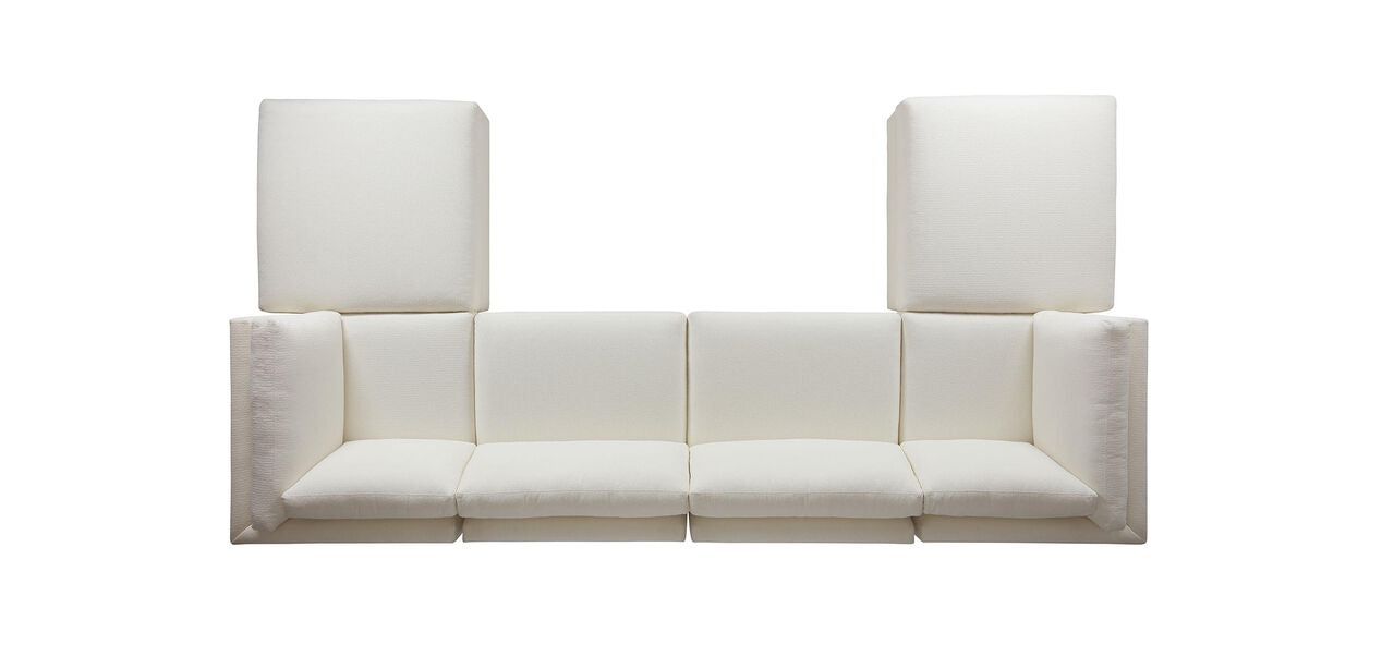 Behold the Daydreamer Modular Six-Piece Sectional: a modern piece in pristine white featuring four square seats and two large back cushions, crafted into a unique geometric design flanked by two tall rectangular elements. The sectional is showcased against a plain white backdrop.