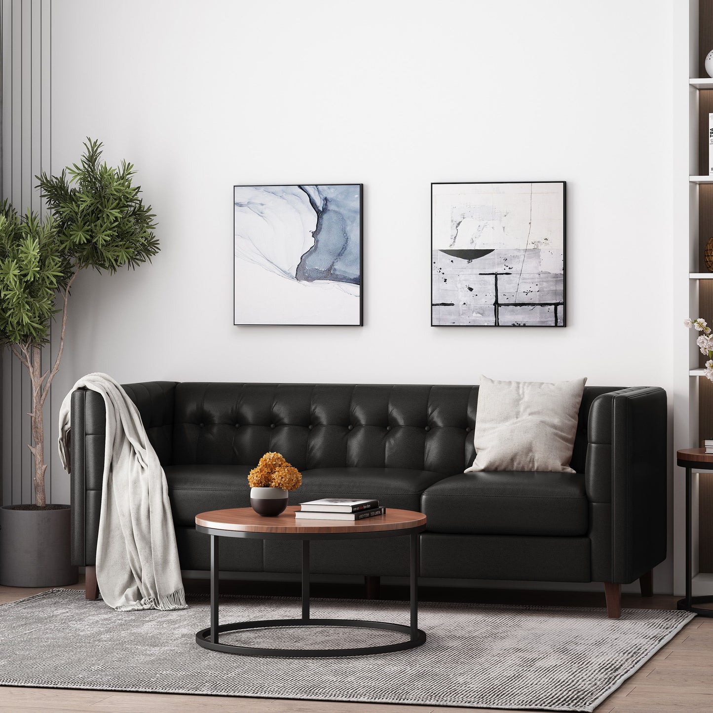 A modern living room features a dark green Comfy 3 Seat Sofa with tufted back, a light gray throw, and beige pillows. A round coffee table with yellow flowers sits in front, two abstract paintings adorn the white wall, and a potted plant stands nearby.