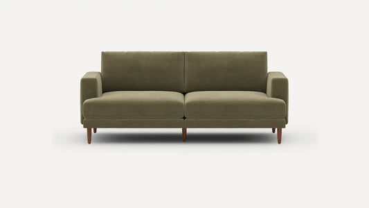 The Ember Mid-Century Modern 75" Sofa is an elegant piece with a minimalist design, showcasing clean lines and wooden legs, all highlighted against a plain white background.