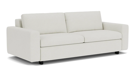 Introducing the Reva Storage Sofa: a modern, minimalist white seating option featuring two large back cushions and wide armrests. Its clean, sleek design rests on short black legs, perfectly contrasting with a plain black background.