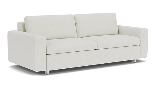 Introducing the Reva Storage Sofa: a modern, minimalist beige piece that boasts clean lines and features two back cushions. Its rectangular armrests and short silver legs contribute to its sleek and contemporary aesthetic.