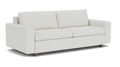 Introducing the Reva Storage Sofa: a contemporary cream-colored sofa featuring two cushions and straight armrests, elegantly set against a simple black background. It boasts a minimalist design with short, dark wooden legs.