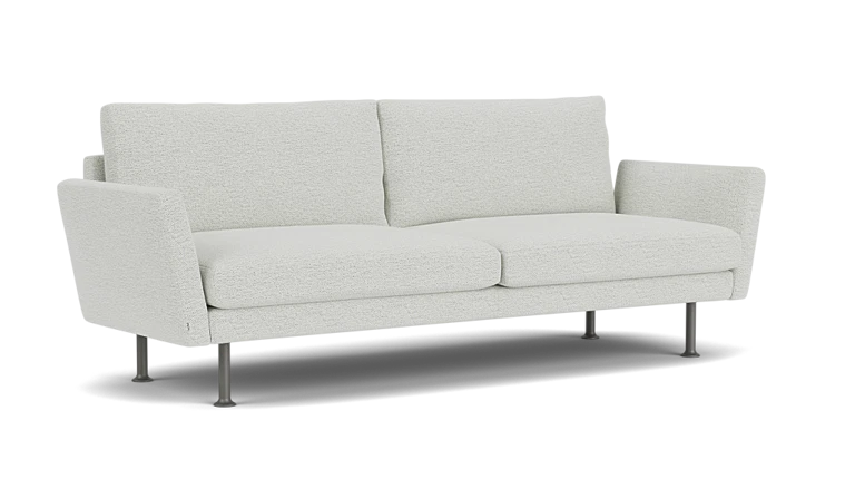 The Form 92" Sofa is a modern piece with light gray upholstery, straight lines, and a minimalist design. It features two seat cushions, two back cushions, and thin metal legs that contribute to its contemporary look.