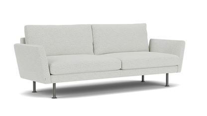 The Form 92" Sofa is a modern piece with light gray upholstery, straight lines, and a minimalist design. It features two seat cushions, two back cushions, and thin metal legs that contribute to its contemporary look.