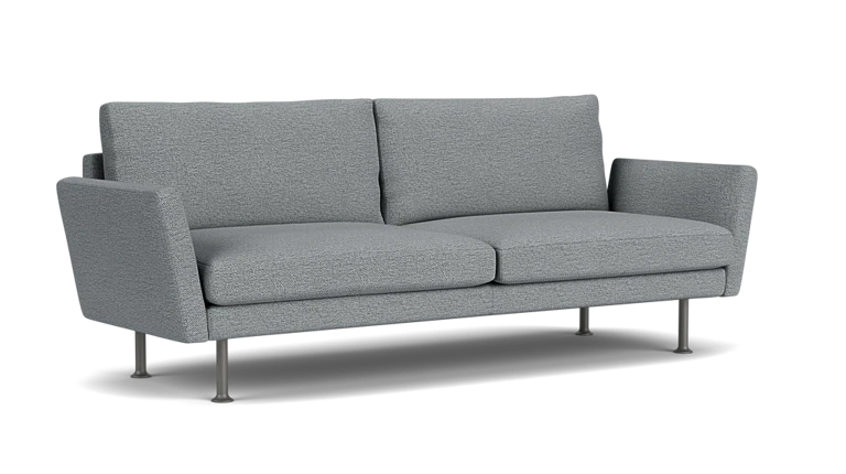 The Form 92" Sofa is a modern piece in gray, featuring two cushions and slim metal legs set against a plain black background. Its design includes slightly angled armrests and embodies a minimalist style.