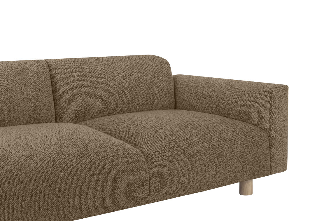 Here's a rewritten version of the sentence using the provided product data:

A close-up view of the Koti 2-seater Sofa, showcasing its modern design with brown fabric and a textured surface. This sofa features a low backrest and an armrest on the right side, supported by cylindrical wooden legs. The background is plain white.