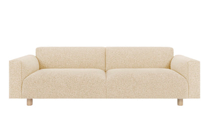 Introducing the Koti 3-seater Sofa: a modern and minimalist seating option in beige, featuring a speckled texture, wide armrests, and round wooden legs that exude simplistic style.