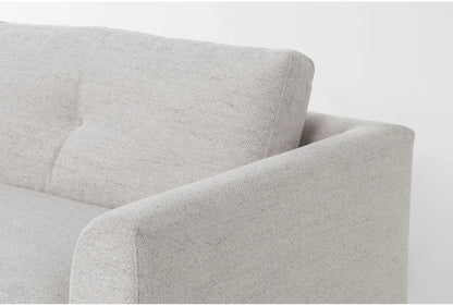 Close-up of Thea Down 101 Inch Beige Chenille Sofa with a textured pattern. The image highlights the armrest and part of the backrest, showcasing the upholstery and stitching details. The sofa sits against a plain white background.