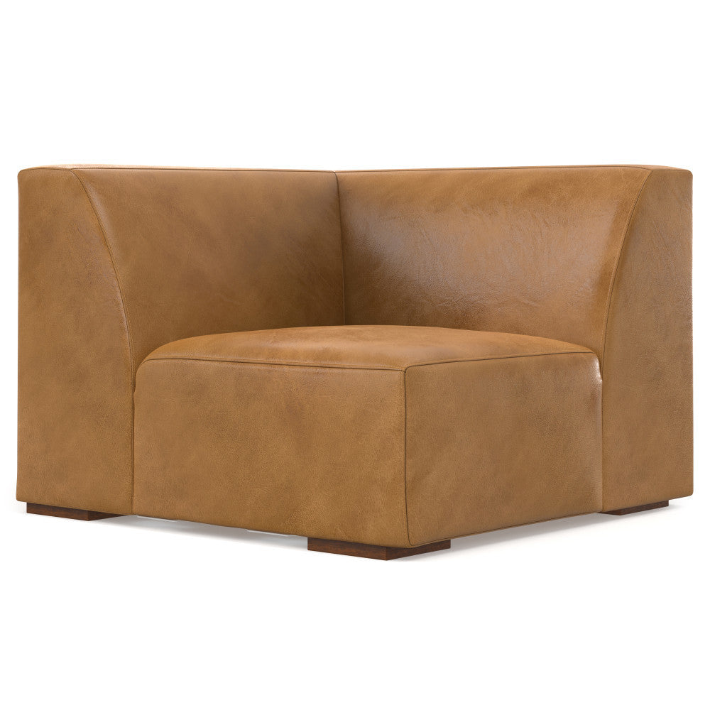 A brown leather corner chair with a smooth texture and minimalist design. It has a high backrest and is supported by small, low-profile legs. The chair features a boxy yet comfortable appearance, making it a stylish addition to modern interiors.