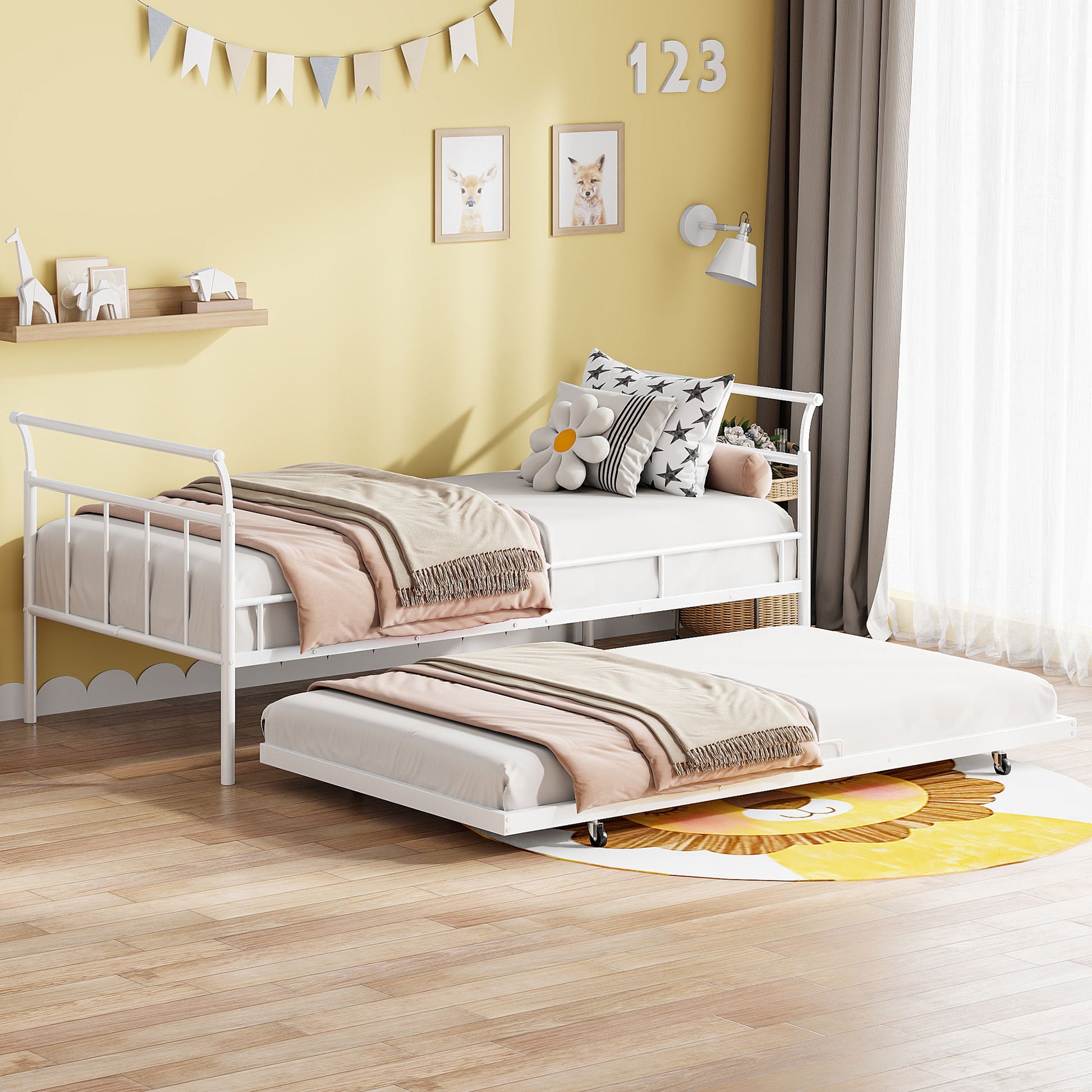 Against a yellow wall adorned with animal prints and numbers, a Daybed With Curved Handle Design And Trundle showcases floral and neutral bedding. The room is completed by a small shelf, wall lamp, and a window framed with beige curtains.