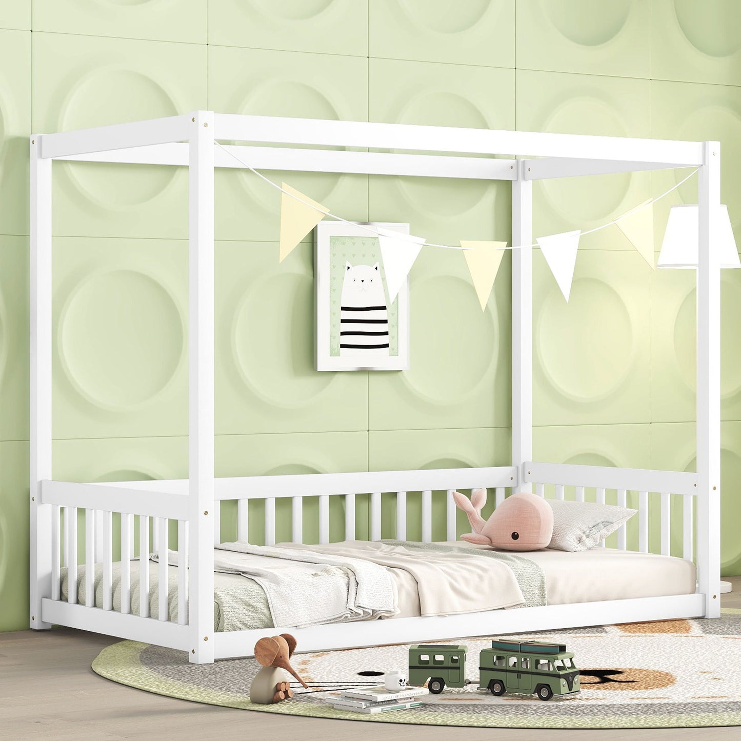 A children's bedroom featuring a white Canopy Frame Floor Bed With Fence, Guardrails against a mint green wall. The bed includes a beige mattress, plush whale toy, and pillows. Above it hangs a triangle banner. Two toy vehicles rest on the round rug below.