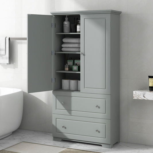 A gray, wide bathroom storage cabinet stands open, showcasing towels and toiletries on adjustable shelves with two closed drawers below. It's freestanding next to a bathtub on a tiled floor.