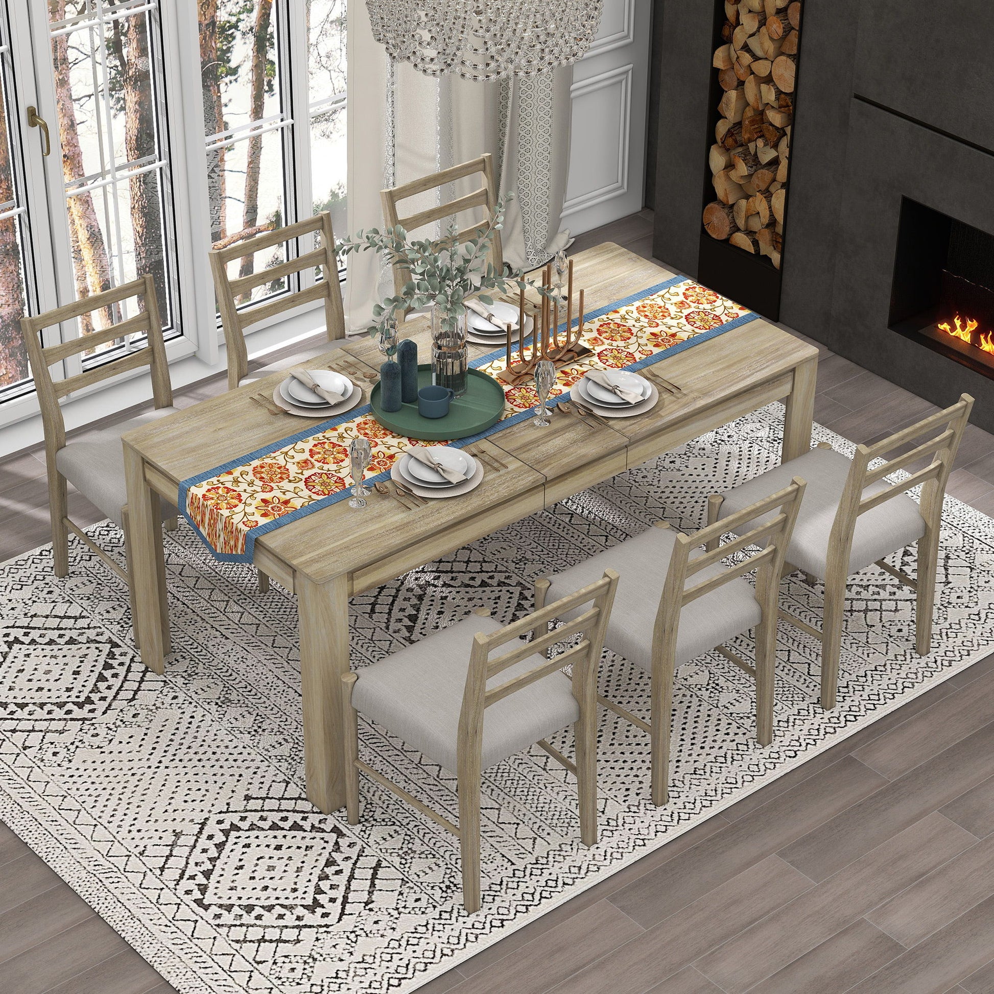 A dining room features a Wooden Dining Table Set Multifunctional Extendable Table with Leaf and 2 Drawers with six cushioned chairs, adorned with a floral and blue runner, candles, and a green centerpiece. The room has a patterned rug, large window with forest view, and modern fireplace.