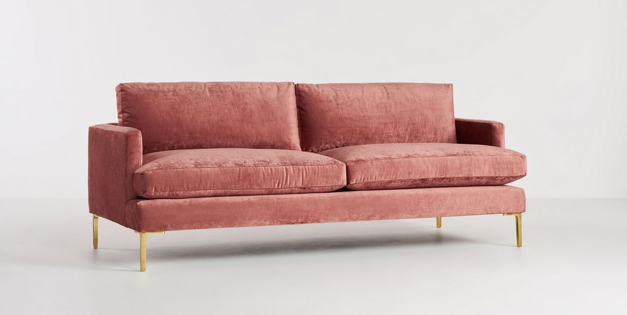 The Bowen 91" Sofa, featuring plush dusty rose-colored velvet upholstery, two large cushions, and slender gold legs, is set against a plain white background.