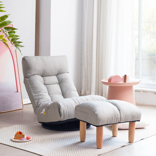 A cozy Reclining Chair - Gray paired with a matching footrest rests on a textured rug. Nearby, a round pink side table with decor sits under sunlight filtering through sheer white curtains, while a leafy plant adds greenery.