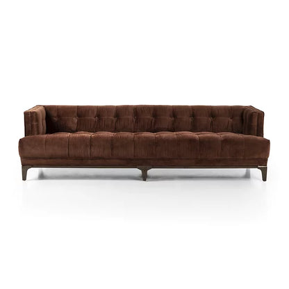 The Dylan Sofa by Four Hands features a modern design with a brown tufted finish, low back, and wooden legs, set against a white background.