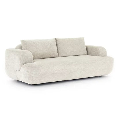 The Benito Sofa by Four Hands offers a modern design with plush, textured light beige fabric. It features two large back cushions and wide, rounded armrests, perfect for adding comfort and style against a sophisticated white backdrop.