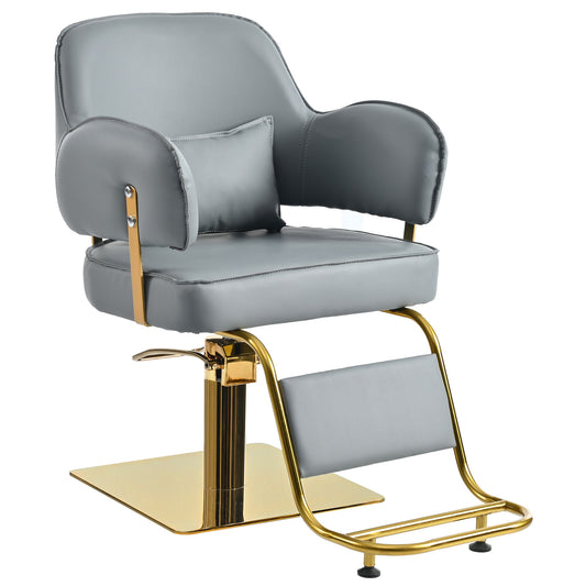 The Elegant Barber Chair features gray cushioned upholstery, a gold metallic base, armrests, backrest, footrest, and an adjustable hydraulic lift on a square platform.