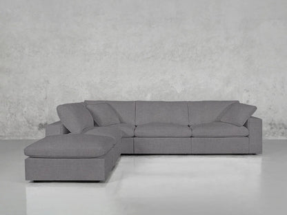 The 5-Seat Modular Corner Lounger Sectional, featuring a modern gray design with a left-facing chaise, is positioned against a textured gray wall. Its clean lines and minimalist aesthetic contribute to a sleek, contemporary look on the shiny gray floor.