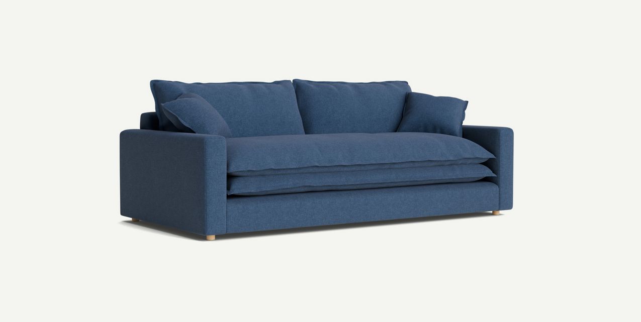 The Meriwether Sofa is a contemporary piece in blue, showcasing a minimalist design with two generously sized seat cushions and two soft back cushions. It boasts a sleek silhouette with straight arms and wooden legs, all framed against a light backdrop.