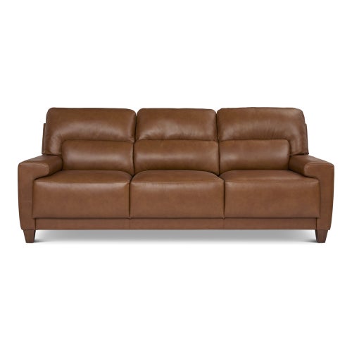 The Draper Sofa is a brown leather piece featuring three cushioned seats and matching armrests, all supported by short wooden legs. It boasts a sleek, modern design that looks both comfortable and spacious.