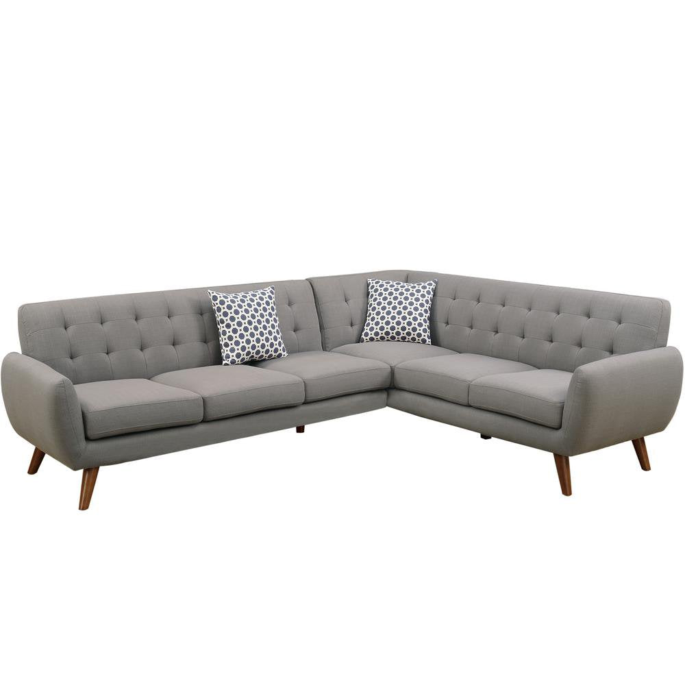 Retro Modern Grey Sectional Sofa featuring an L-shaped design with tufted back cushions and wooden legs. Includes two decorative pillows showcasing geometric black-and-white patterns for added contrast.