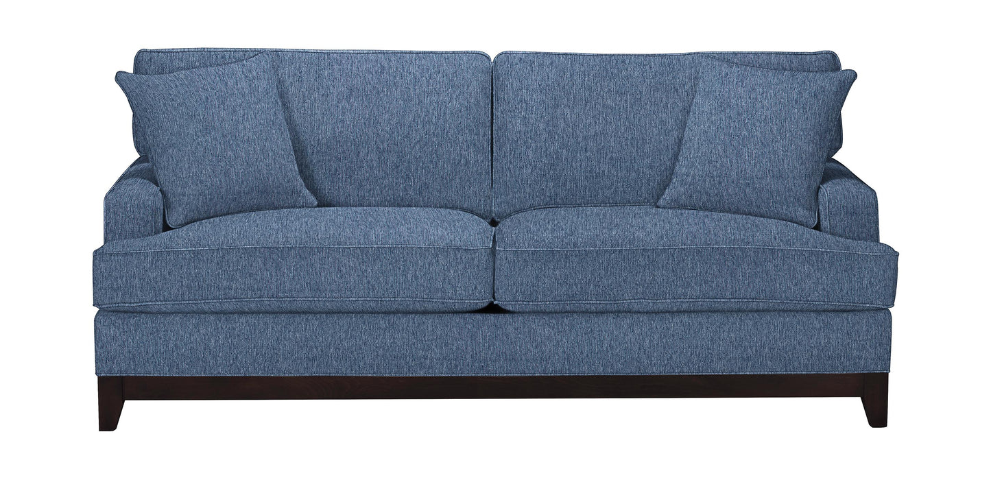 The Arcata Sofa, Quick Ship features a modern design in blue fabric with two large back cushions and two smaller side cushions, all supported by a dark wooden base.