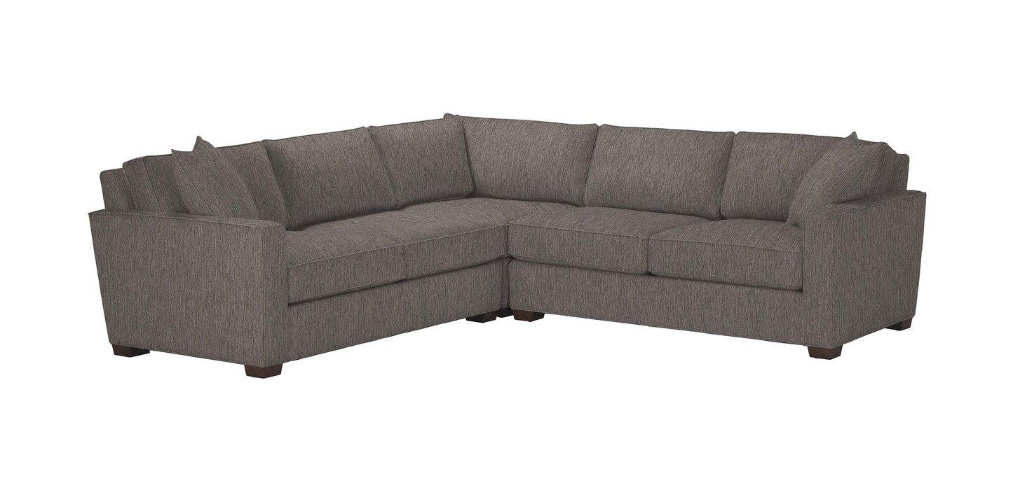 Introducing the Spencer Track-Arm 3-Piece Sectional - a gray L-shaped sofa with a contemporary design, featuring six cushions and short wooden legs. This piece offers a simple and elegant appearance, making it an ideal addition to any modern living room.