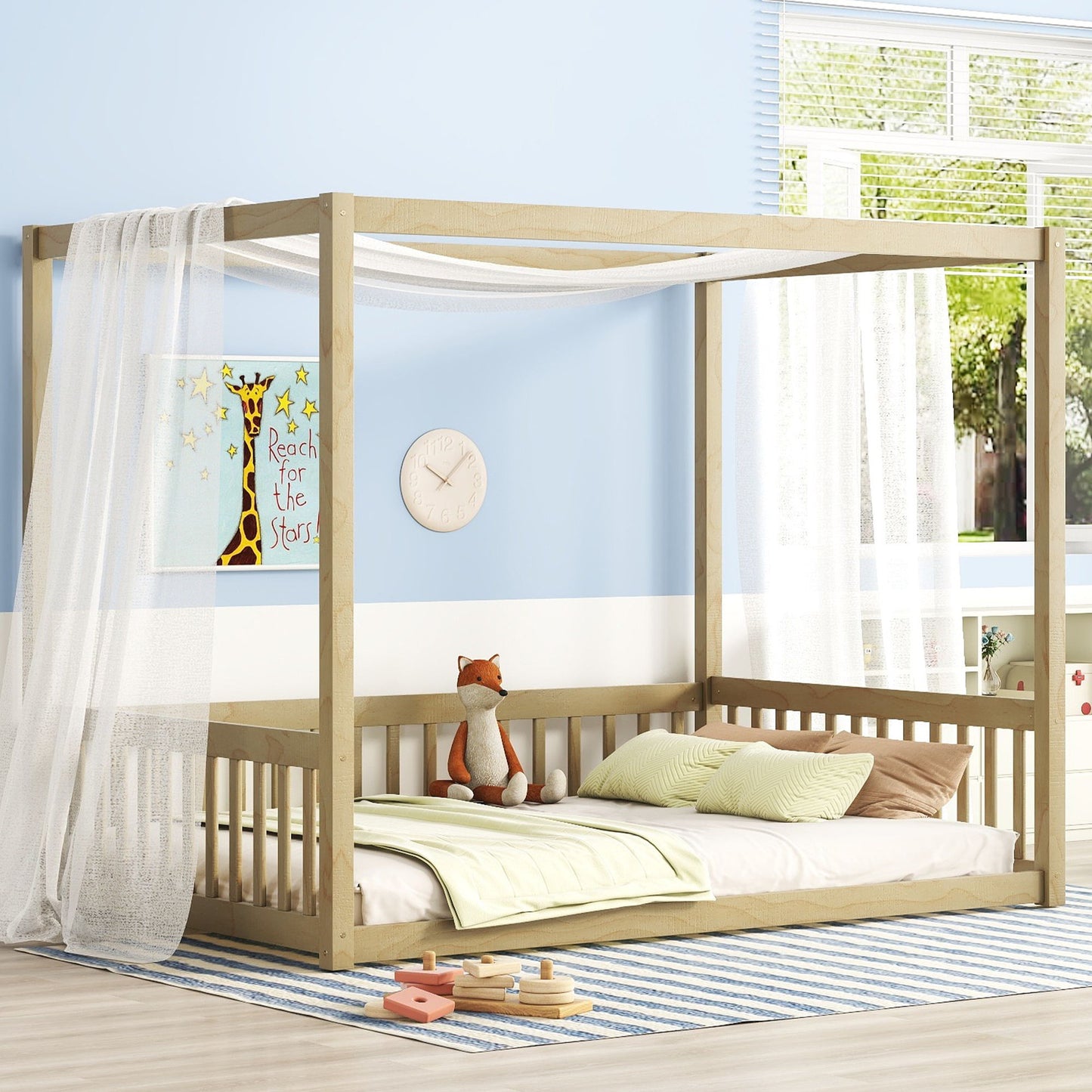 Children's bedroom features a Canopy Frame Floor Bed With Fence and Guardrails, adorned with white curtains. Light green bedding complements the fox plush. A giraffe wall art reads "Reach for the Stars." Above a striped rug, a round clock is mounted on a light blue wall.