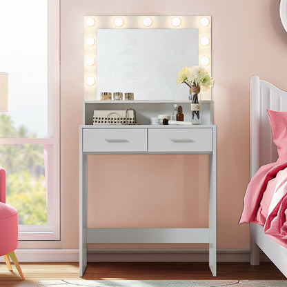 A Vanity Desk with a lighted mirror and large drawer, featuring 2-level storage and adjustable brightness in 3 modes, stands against a peach wall near a window, beside a bed with pink bedding. It holds makeup items and brushes on top.