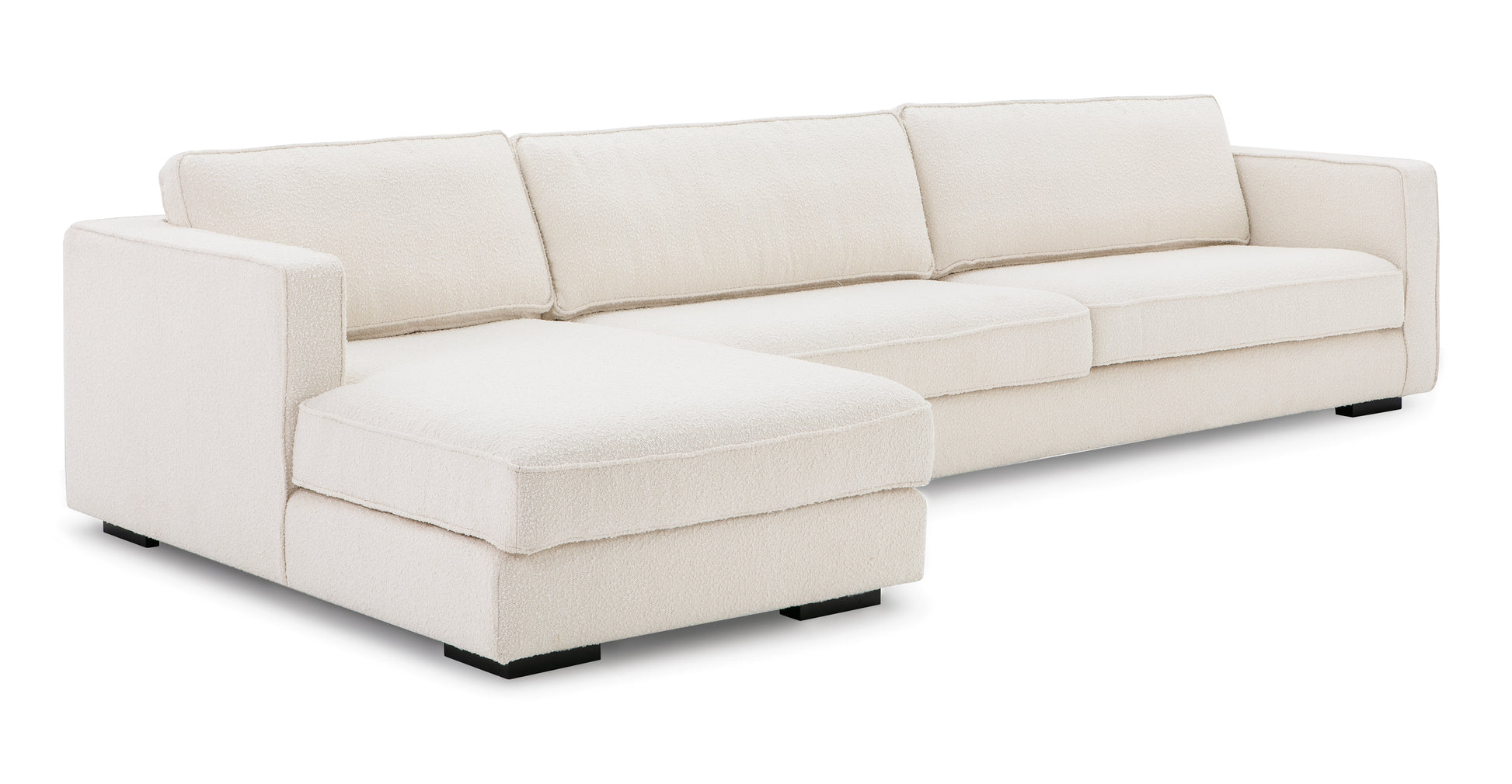 The Architect 133" Fabric Sofa Sectional Left in Blanc Boucle is a modern L-shaped sofa featuring plush cushions and low square black legs, elegantly set against a plain white background.