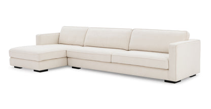 The Architect 133" Fabric Sofa Sectional Left in Blanc Boucle is a modern L-shaped sofa with cushioned backrests, wide armrests, and a chaise lounge on the left side. It stands on sturdy black legs and features a sleek design perfect for contemporary living spaces.