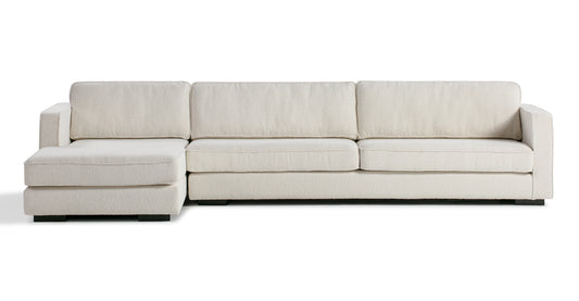 The Architect 133" Fabric Sofa Sectional Left in Blanc Boucle, featuring plush cushions and blocky armrests, is set against a plain white background.