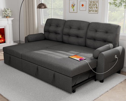 A fully extended Altari Queen Sofa Sleeper in grey, accented with cushions, sits in a bright living room. On the sofa rests an orange tablet accompanied by a charging cable. The room is adorned with a floor lamp, fireplace, and framed art on the wall. Large windows provide a view of the garden outside.
